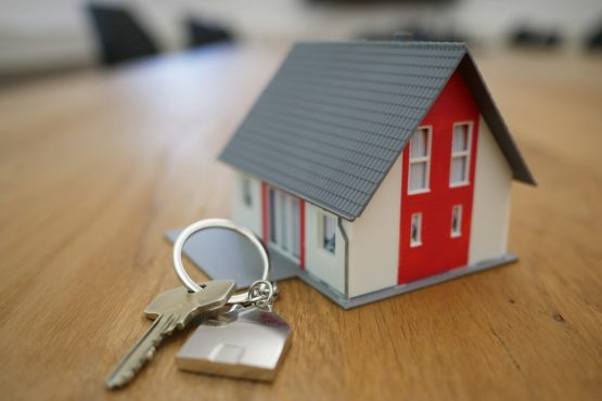 Image of wooden house with keys on table